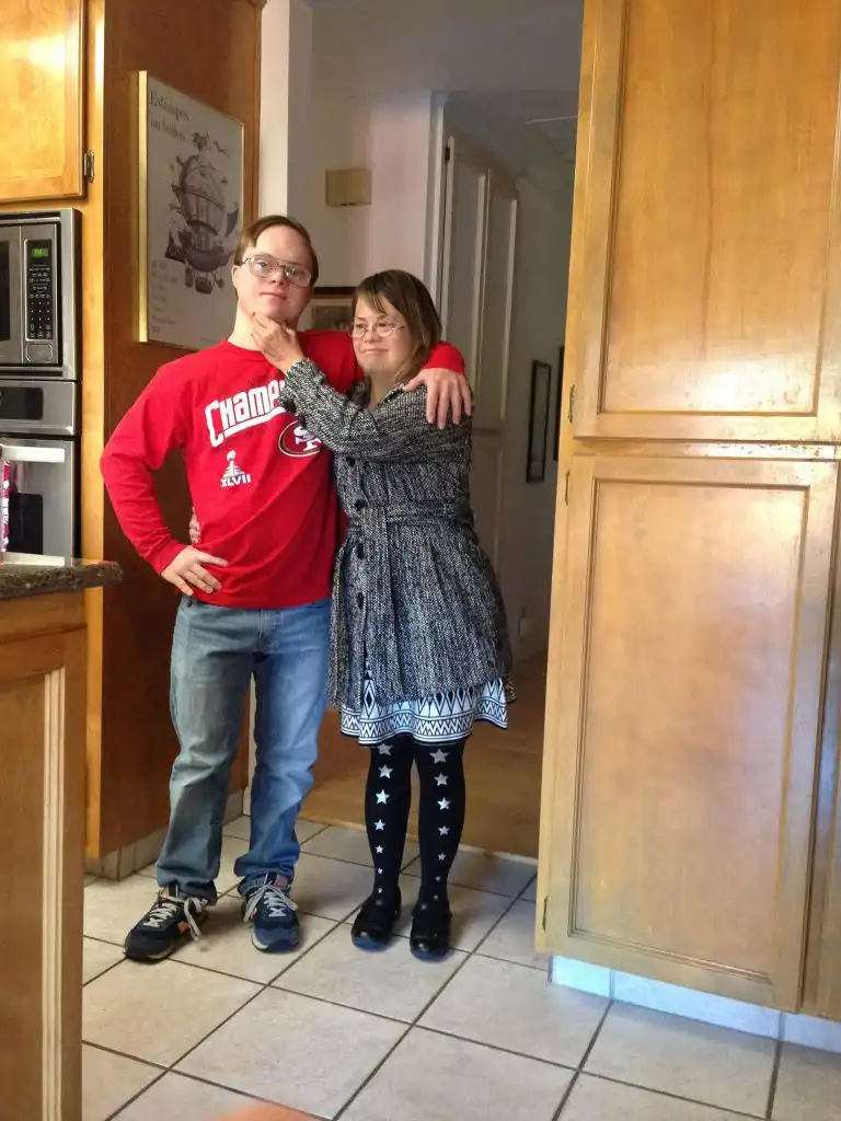 A family portrait showing an adult mother, her adult son (Nic).