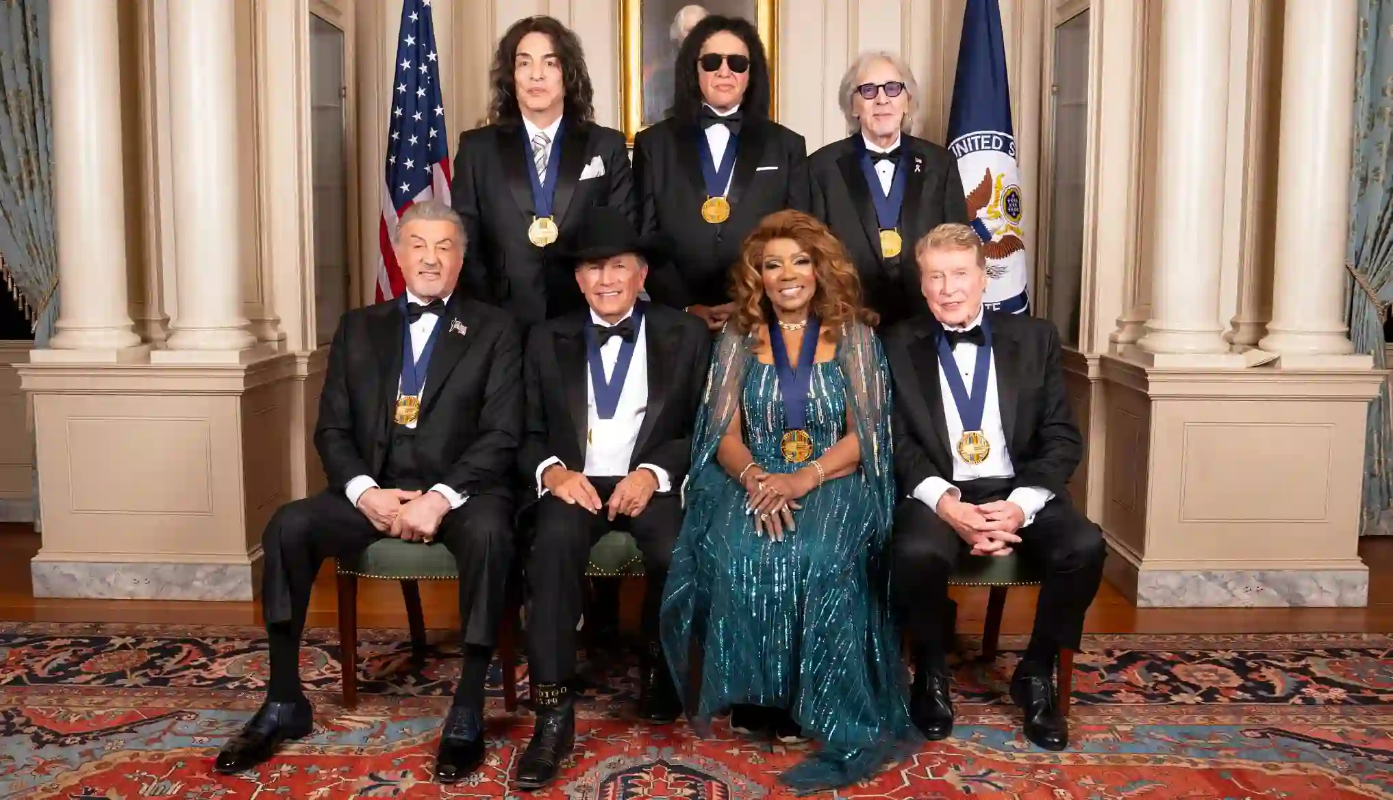 A professional photo montage of the diverse 2025 Kennedy Center Honors recipients: George Strait, KISS, Gloria Gaynor, Michael Crawford, and Sylvester Stallone.