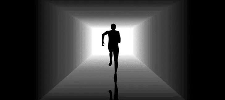 Silhouette of a person in a tunnel illusion
