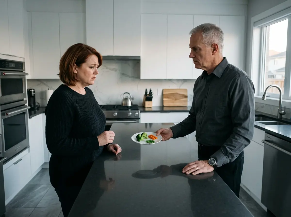 Mike handing Sarah an extremely small, portion-controlled plate of food