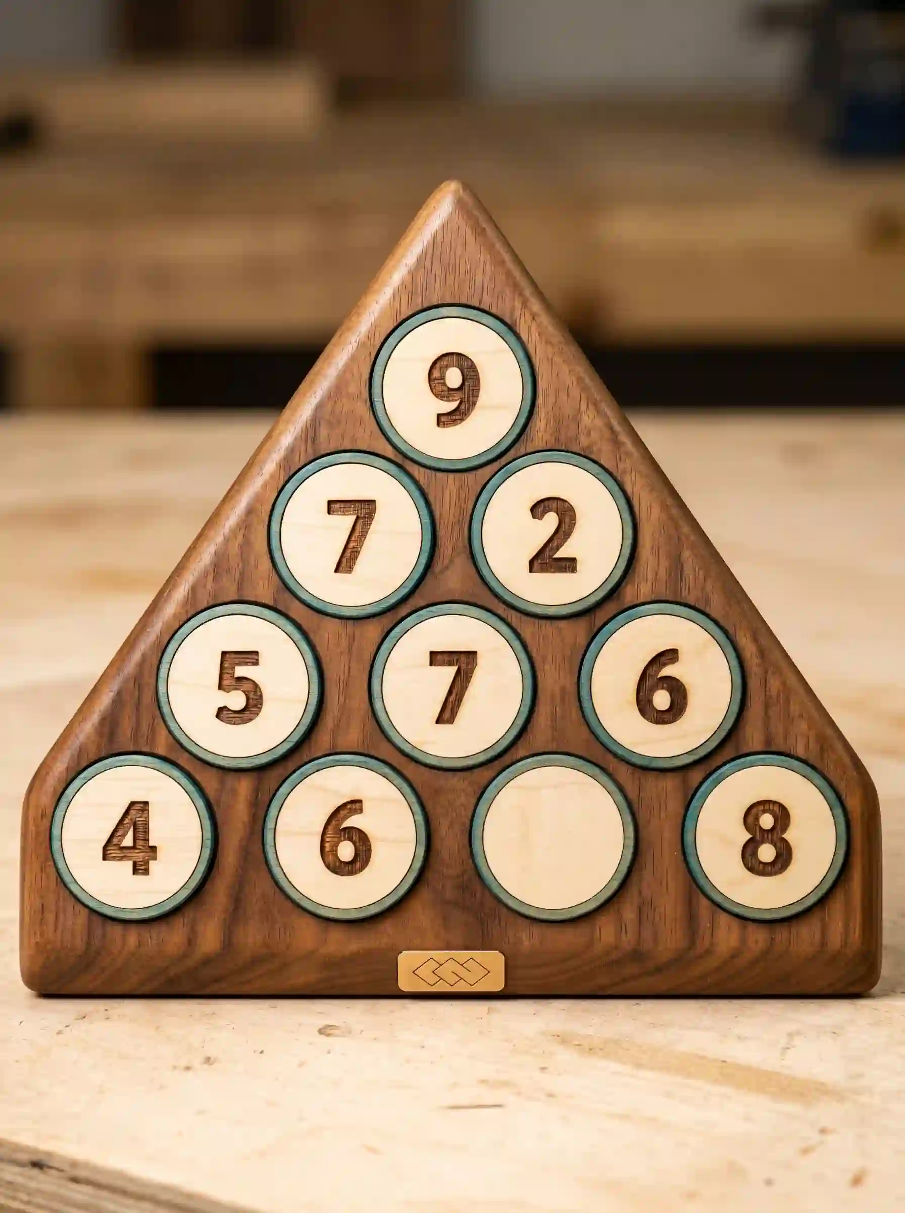 Wooden number pyramid with a missing number in the bottom row
